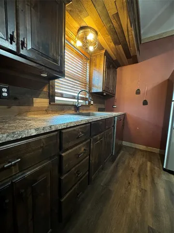 a kitchen with a sink and cabinets
