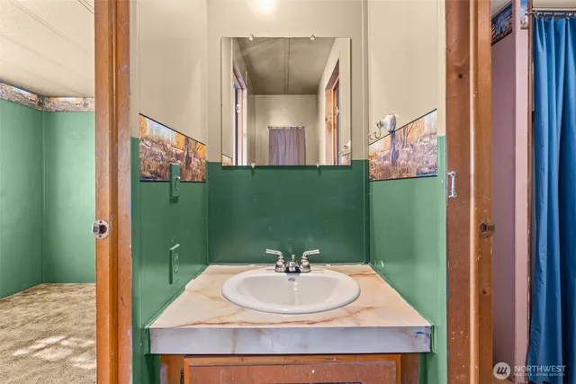 a view of room with window and cabinet