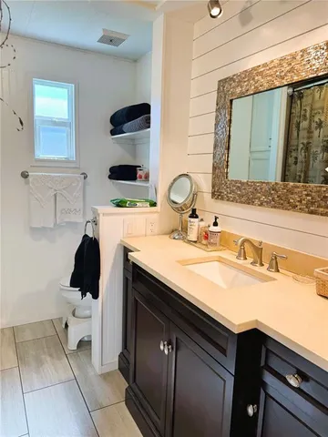 a bedroom with bed and window