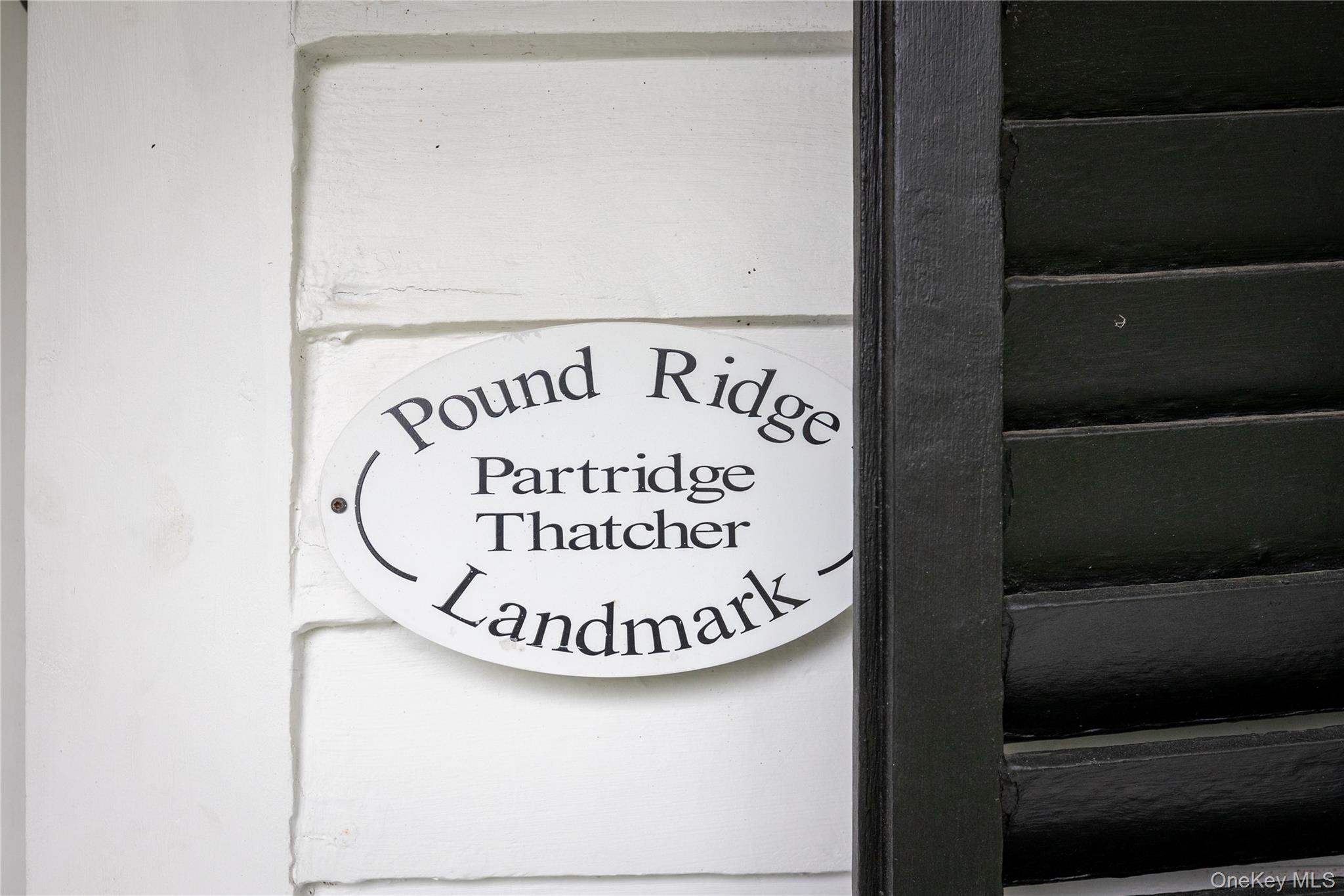 23 Pound Ridge Road Pound Ridge, NY 10576 - Photo 4 of 40 a sign that is on the side of a building