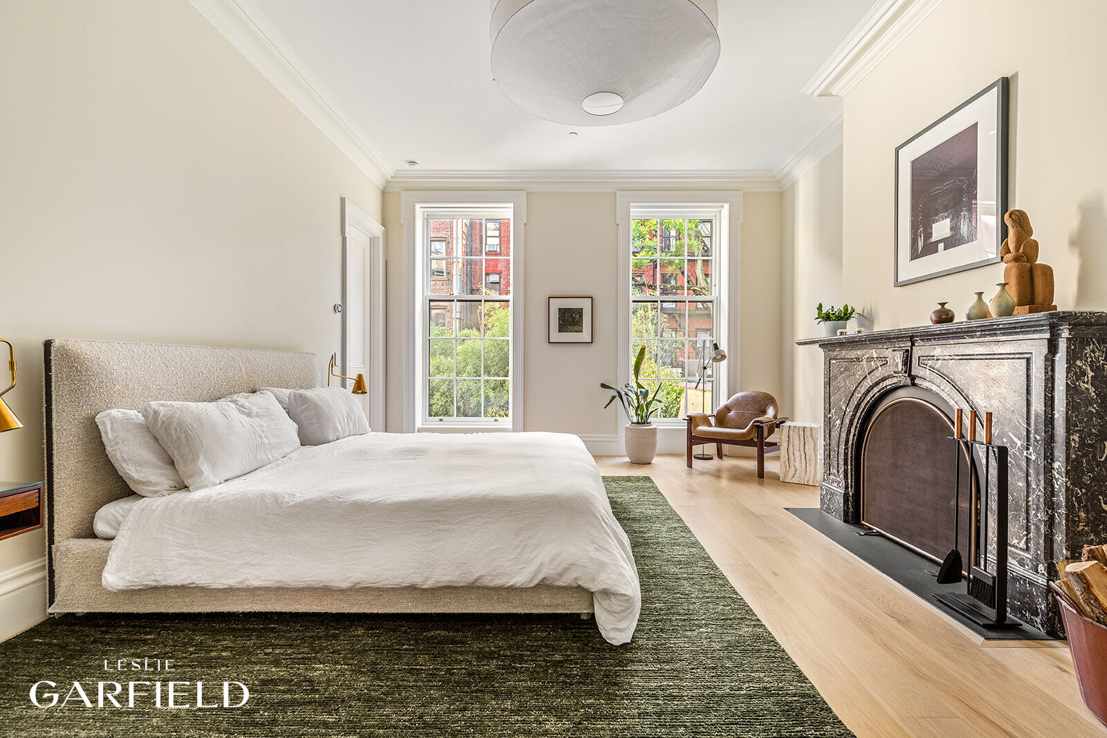 60 West 9th Street Manhattan, NY 10011 - Photo 10 of 22 a bedroom with bed and a couch