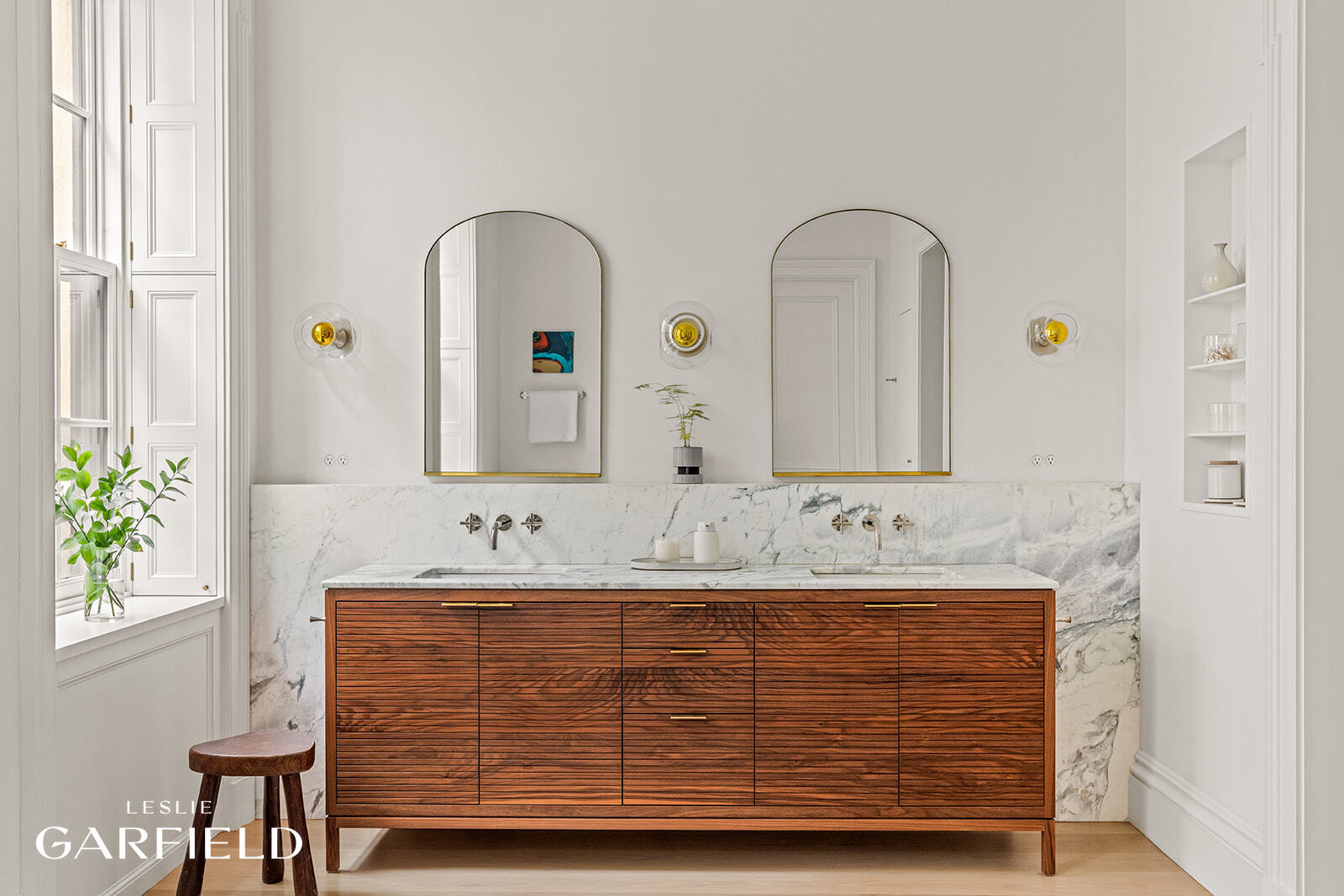 60 West 9th Street Manhattan, NY 10011 - Photo 11 of 22 a bathroom with a double vanity sink and a mirror