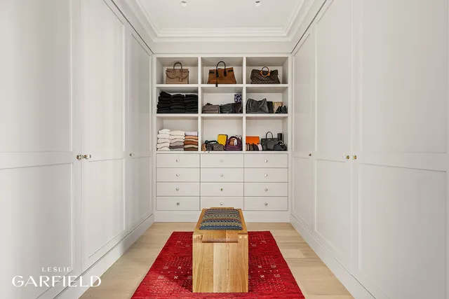 a bathroom with a granite countertop shower and a window