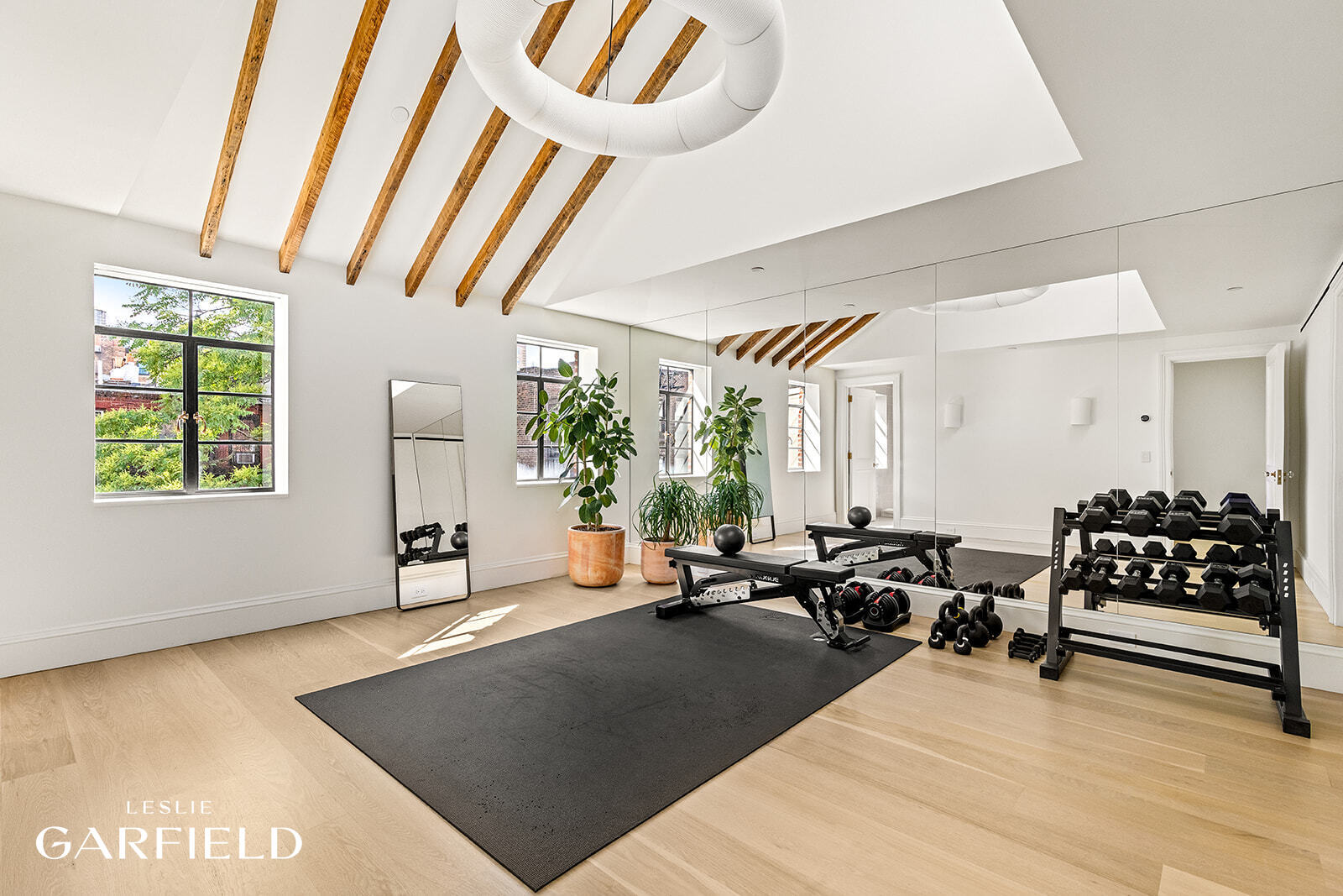 60 West 9th Street Manhattan, NY 10011 - Photo 16 of 22 a living room with furniture and a large window