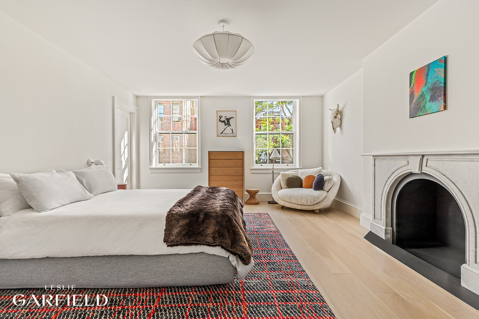 60 West 9th Street Manhattan, NY 10011 - Photo 17 of 22 a living room with furniture and a fireplace