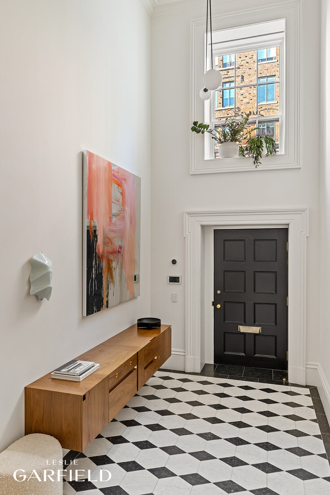 60 West 9th Street Manhattan, NY 10011 - Photo 20 of 22 a living room with furniture and a window
