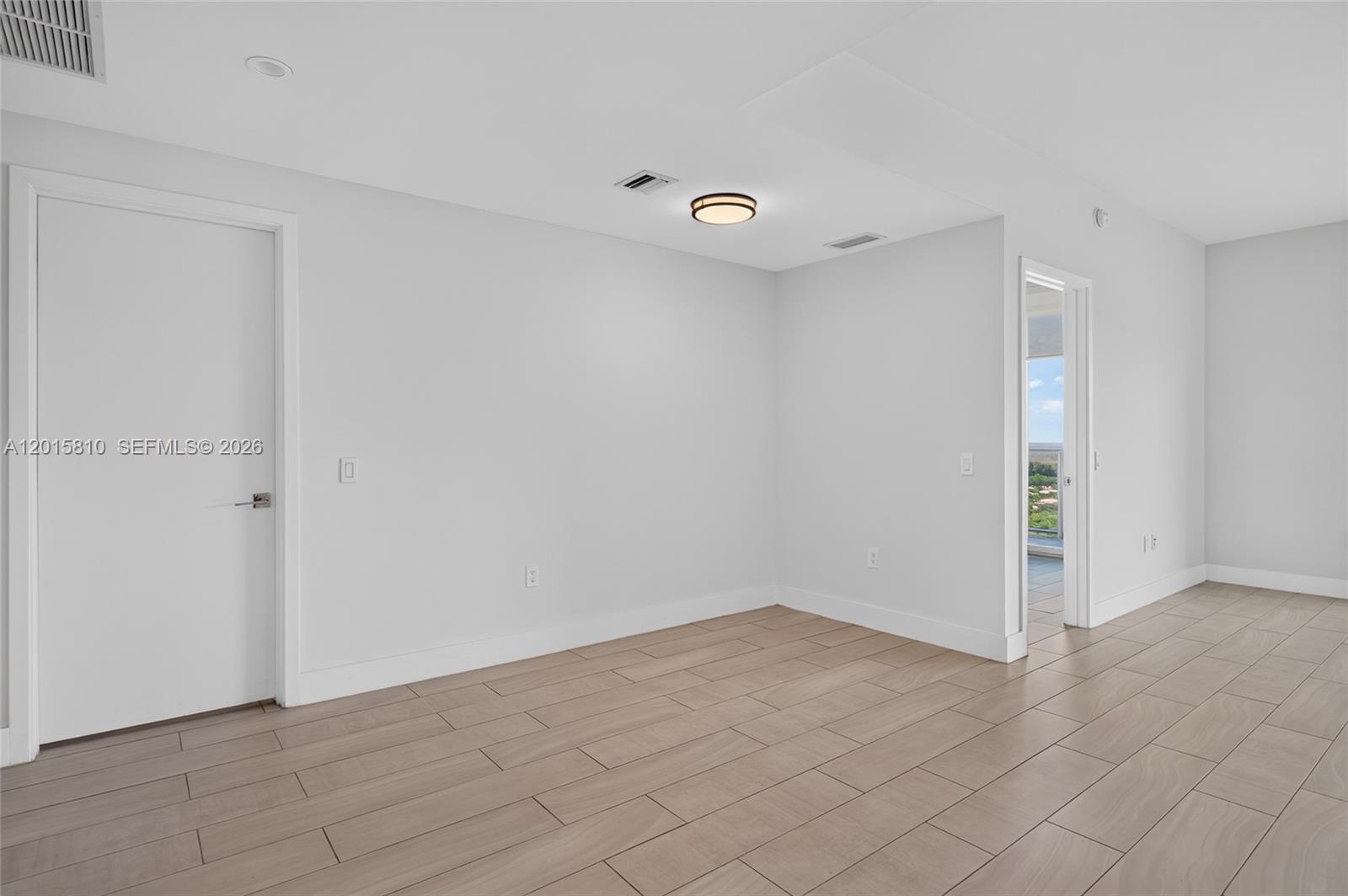 2000 Metropica Way, Unit 1902 Sunrise, FL 33323 - Photo 29 of 40 wooden floor in an empty room