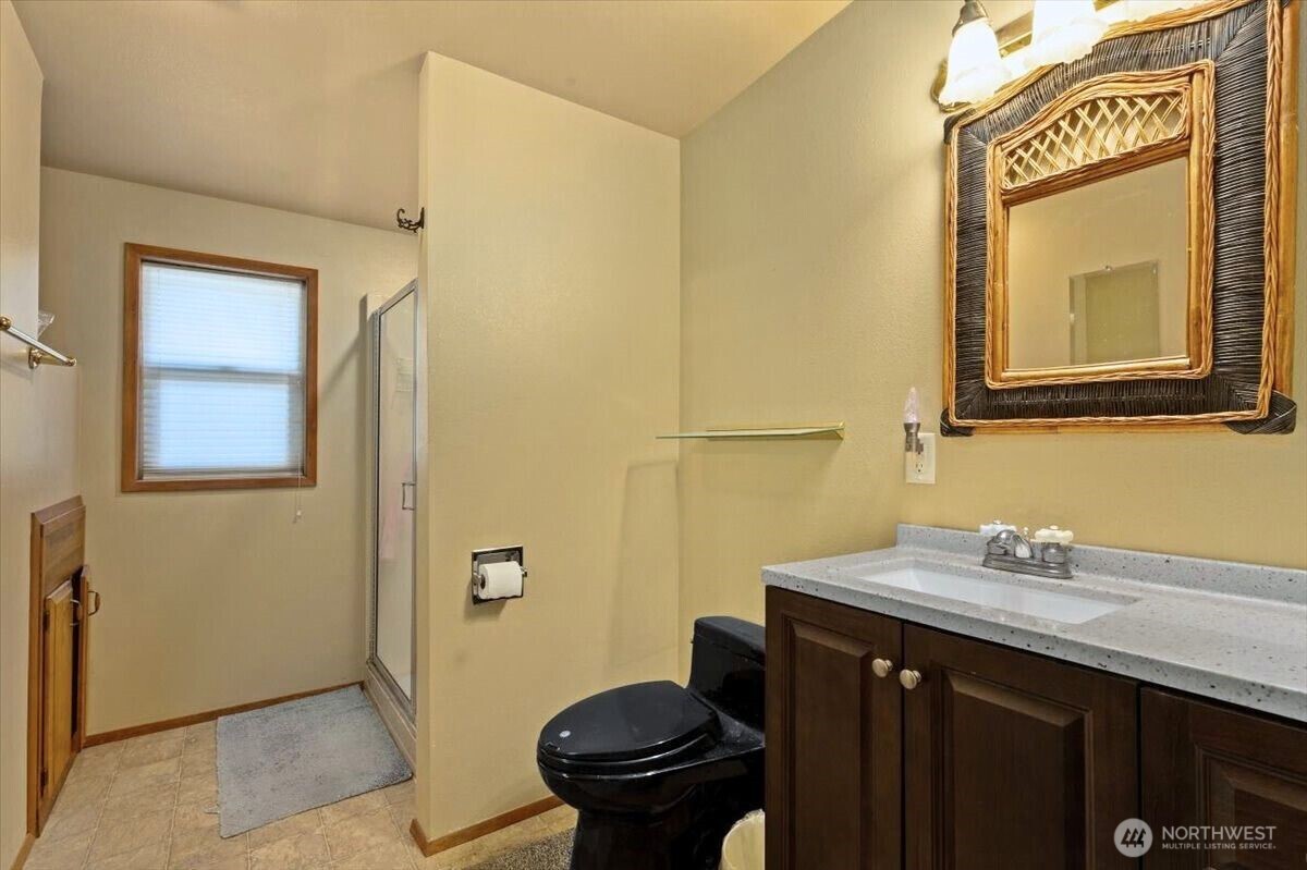 475 Totem Pole Road Manson, WA 98831 - Photo 17 of 33 a bathroom with a sink a toilet and mirror
