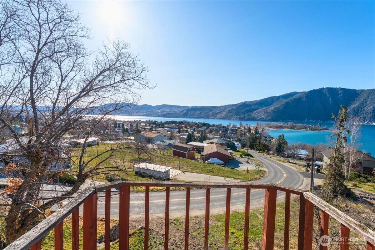475 Totem Pole Road Manson, WA 98831 - Photo 21 of 33 a view of a two chairs and table in the balcony