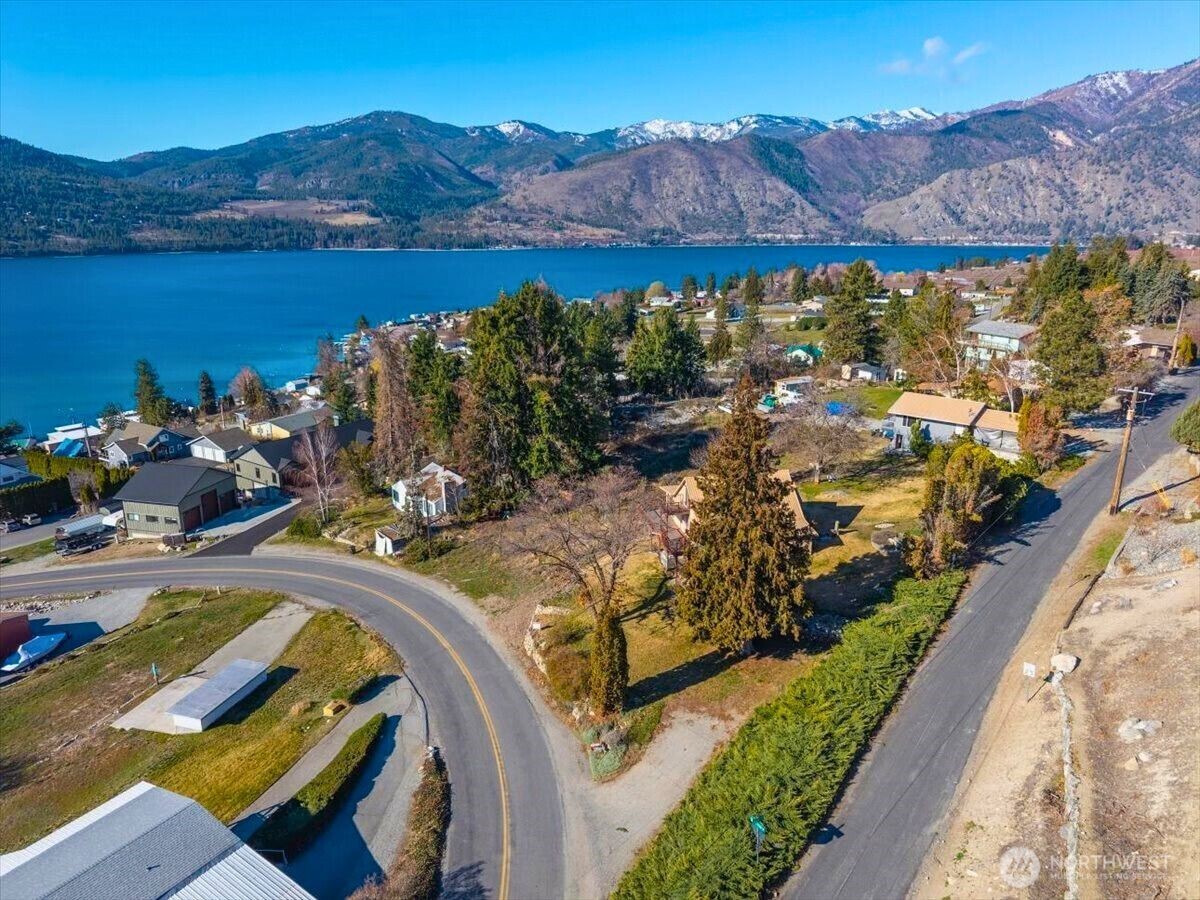 475 Totem Pole Road Manson, WA 98831 - Photo 28 of 33 a view of a lake with a mountain