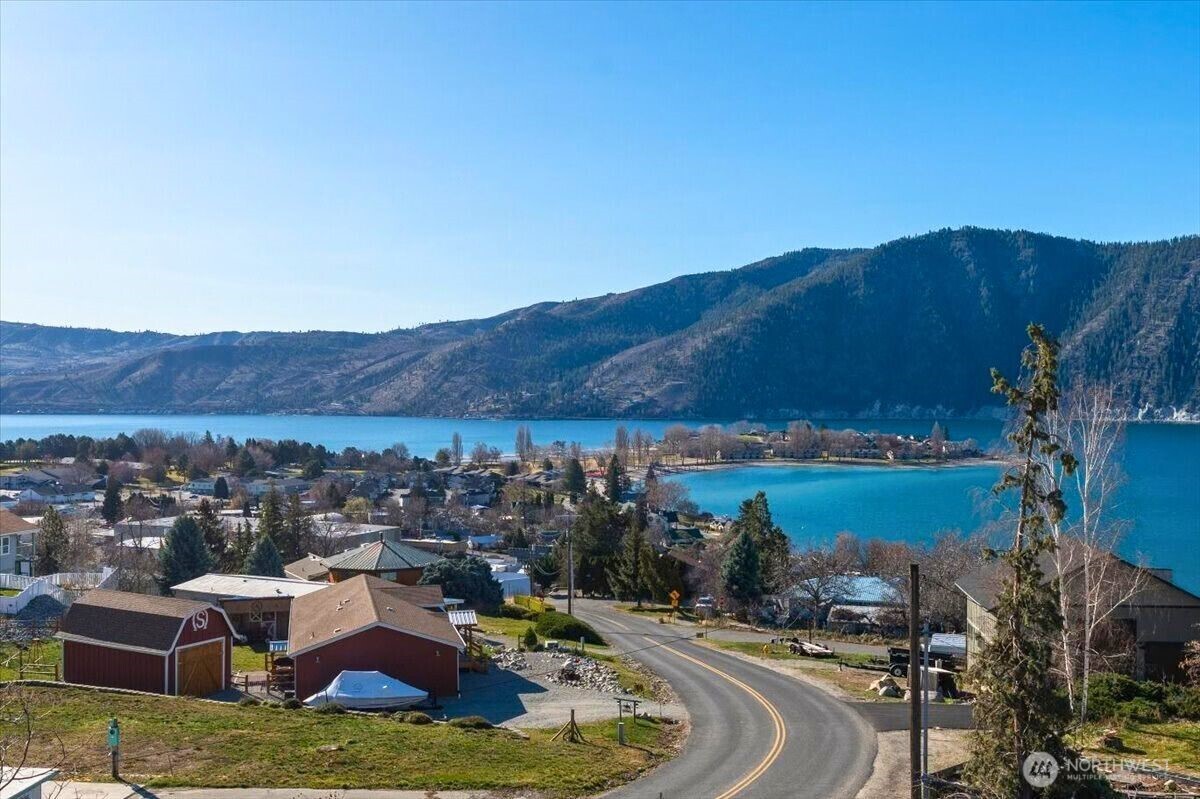 475 Totem Pole Road Manson, WA 98831 - Photo 4 of 33 a view of a lake with a mountain