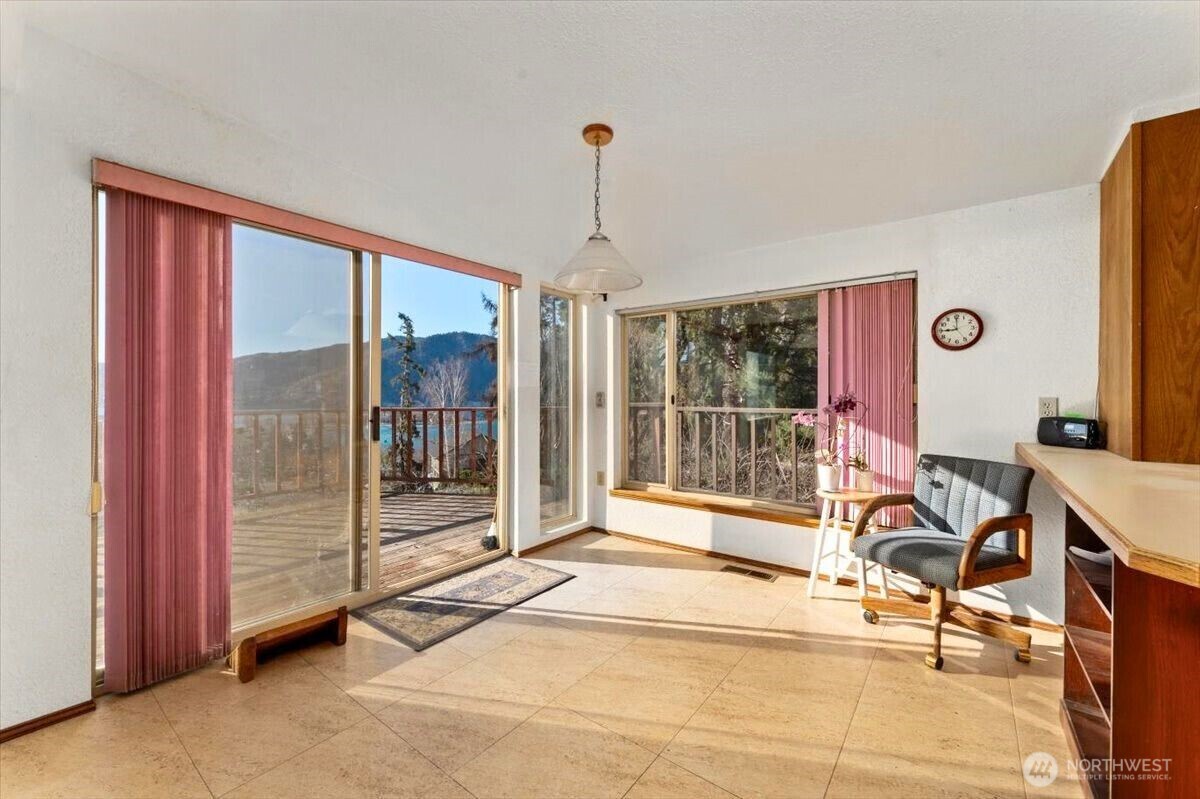 475 Totem Pole Road Manson, WA 98831 - Photo 10 of 33 a view of a livingroom with furniture and door