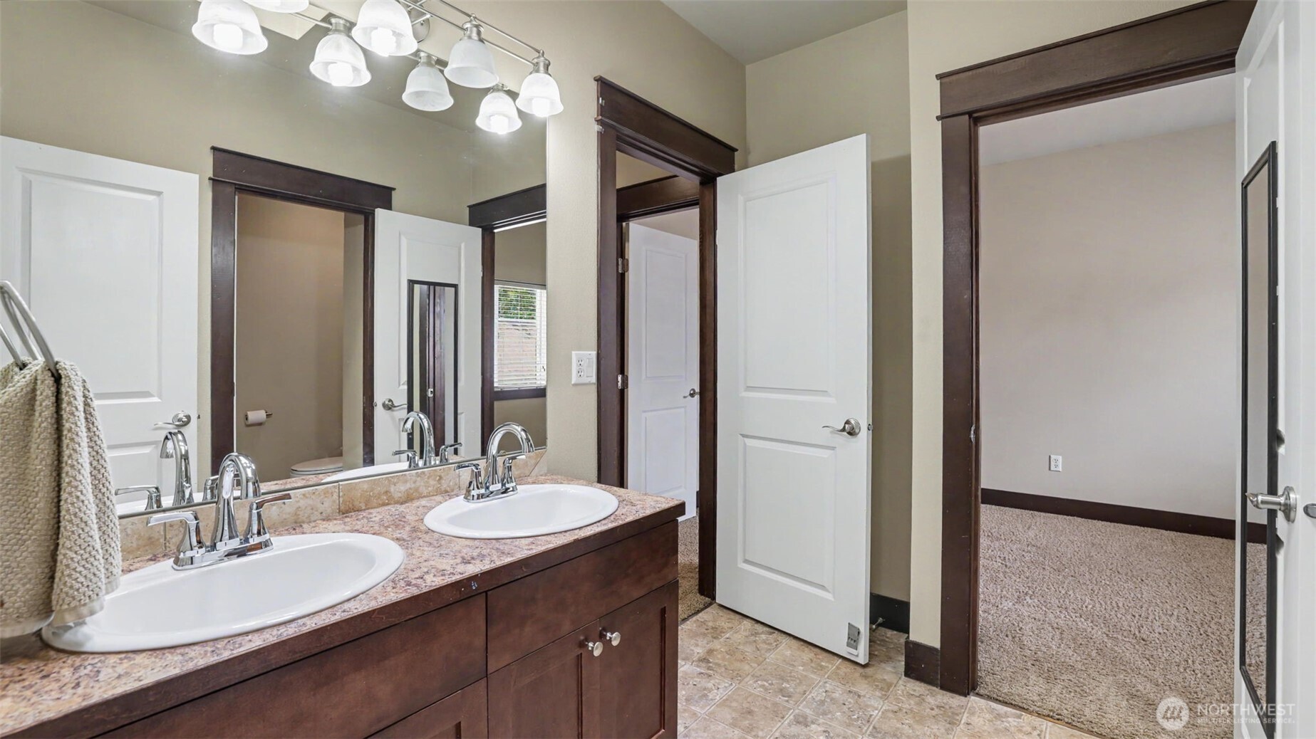 1357 Elma Place Northeast Renton, WA 98059 - Photo 25 of 40 a bathroom with a granite countertop sink and a mirror