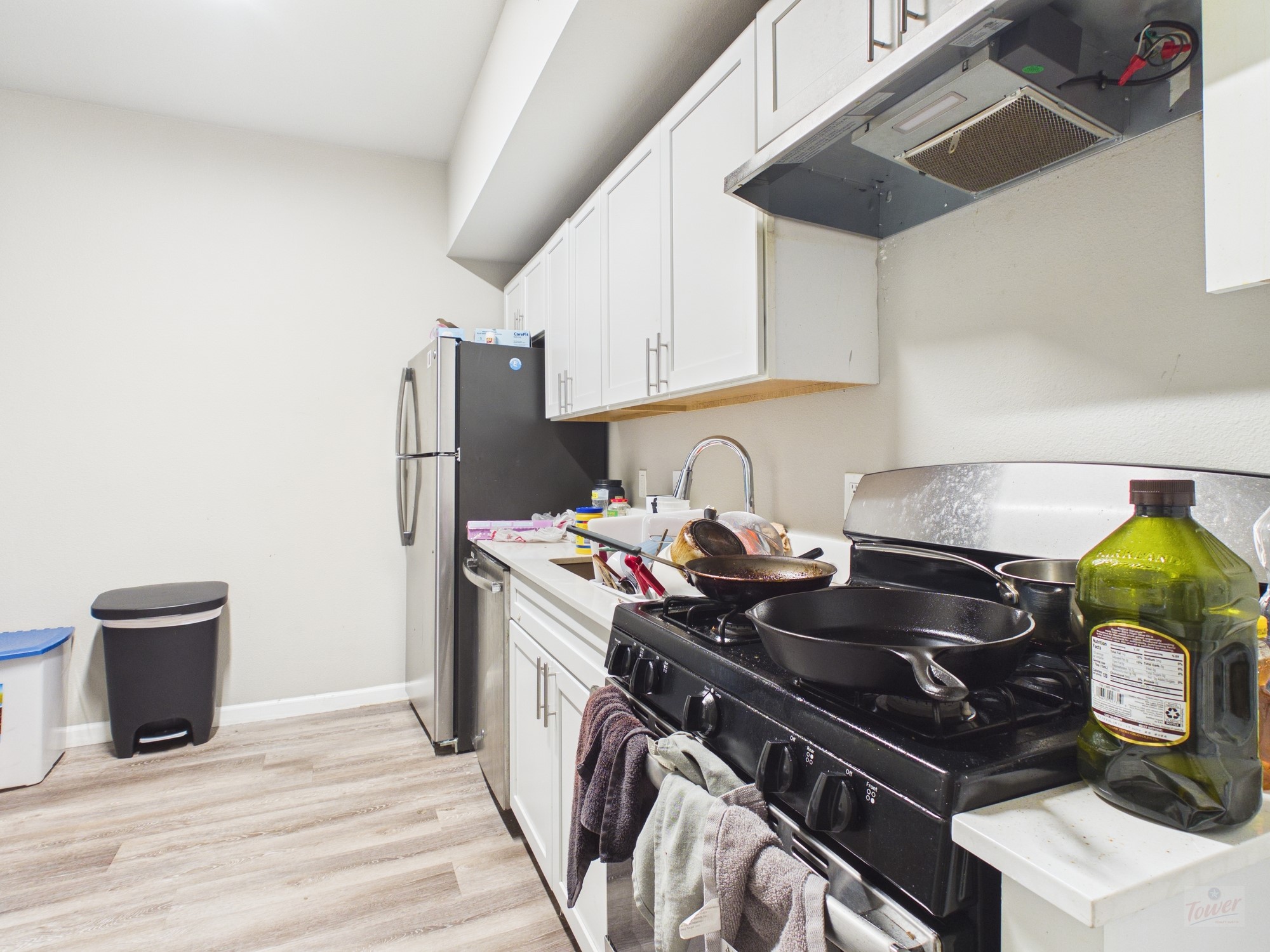 a kitchen with a stove and a refrigerator