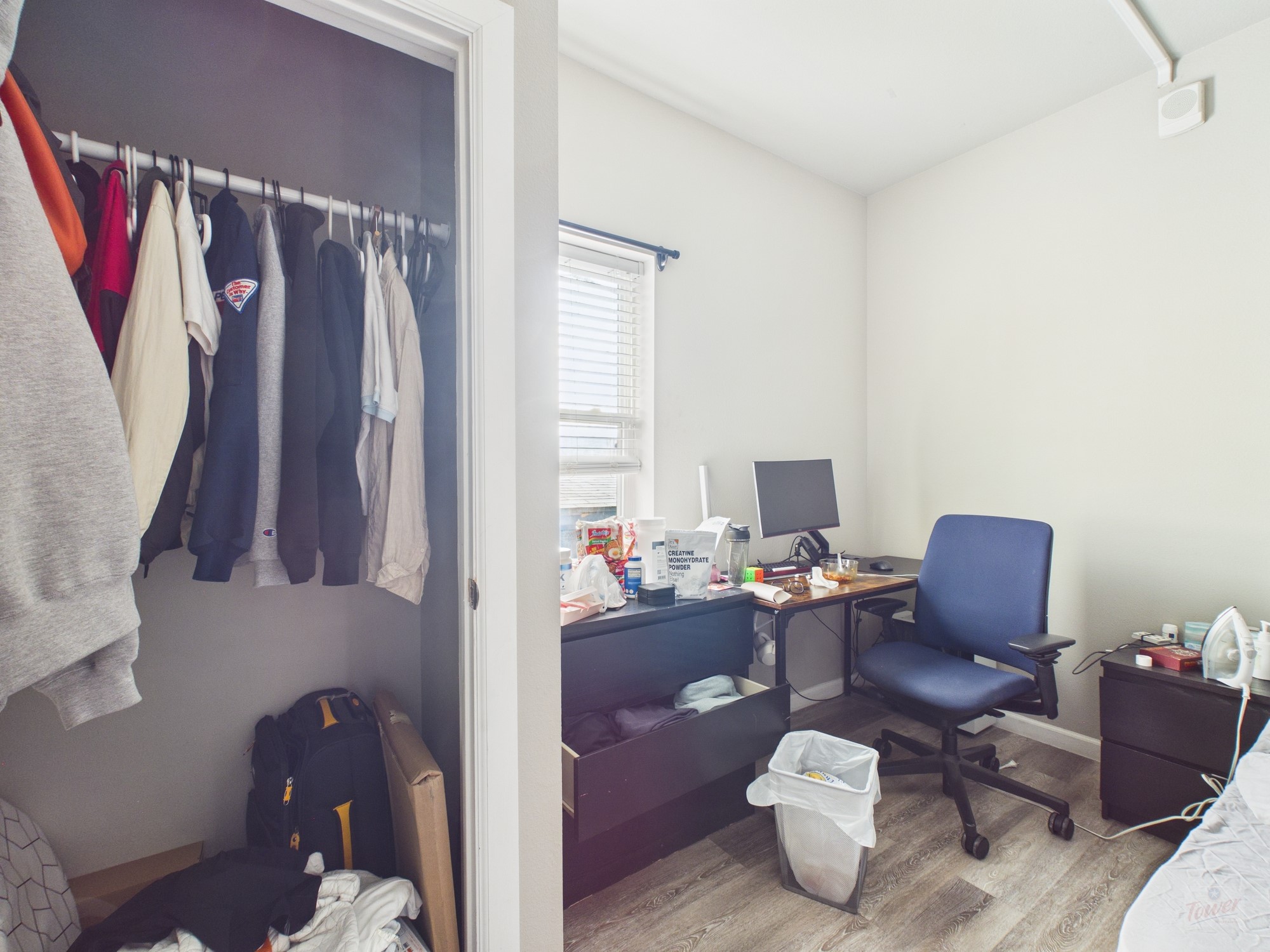 911 West 22nd Street, Unit 404 Austin, TX 78705 - Photo 11 of 13 a living room with furniture and a window