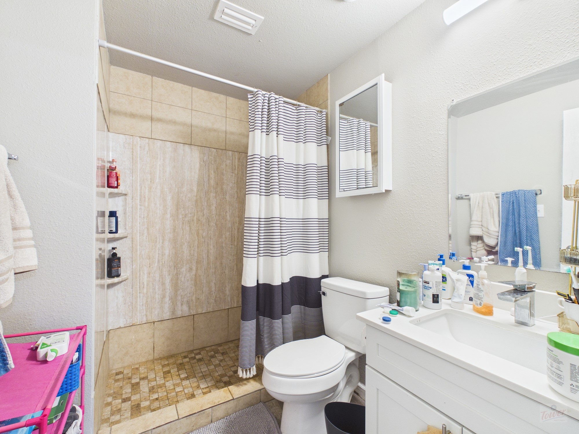911 West 22nd Street, Unit 404 Austin, TX 78705 - Photo 13 of 13 a bathroom with a sink toilet and shower