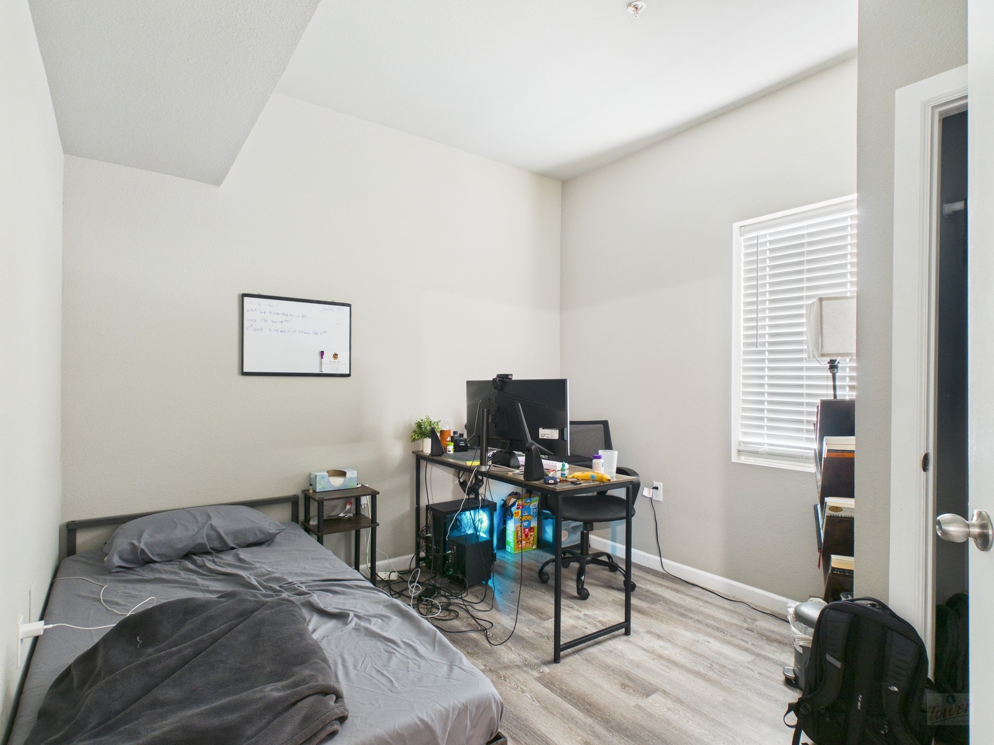 911 West 22nd Street, Unit 404 Austin, TX 78705 - Photo 7 of 13 a bedroom with a bed and a computer on a desk