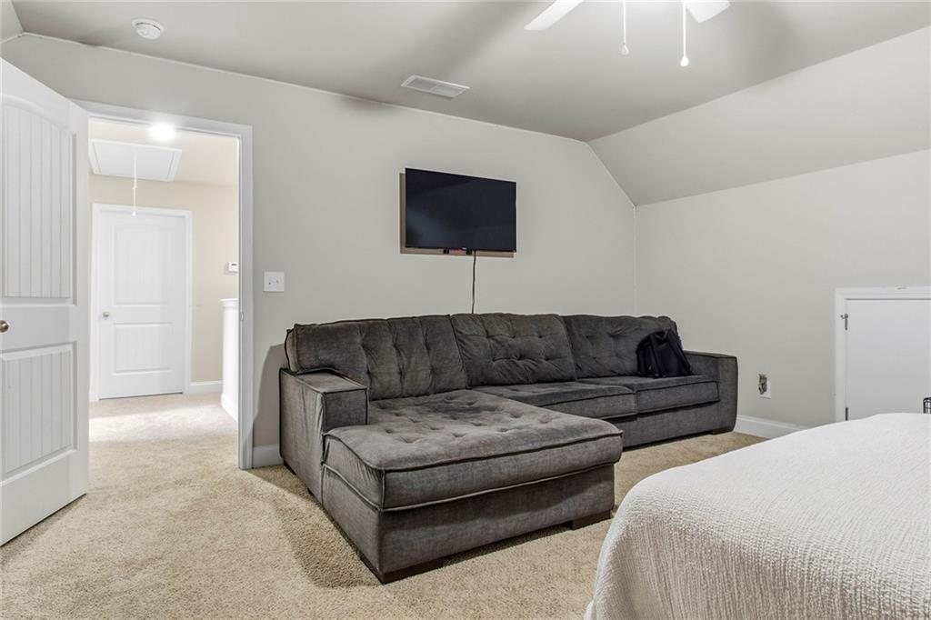 171 Strickland Loop Forsyth, GA 31029 - Photo 19 of 25 a living room with couches and a flat screen tv