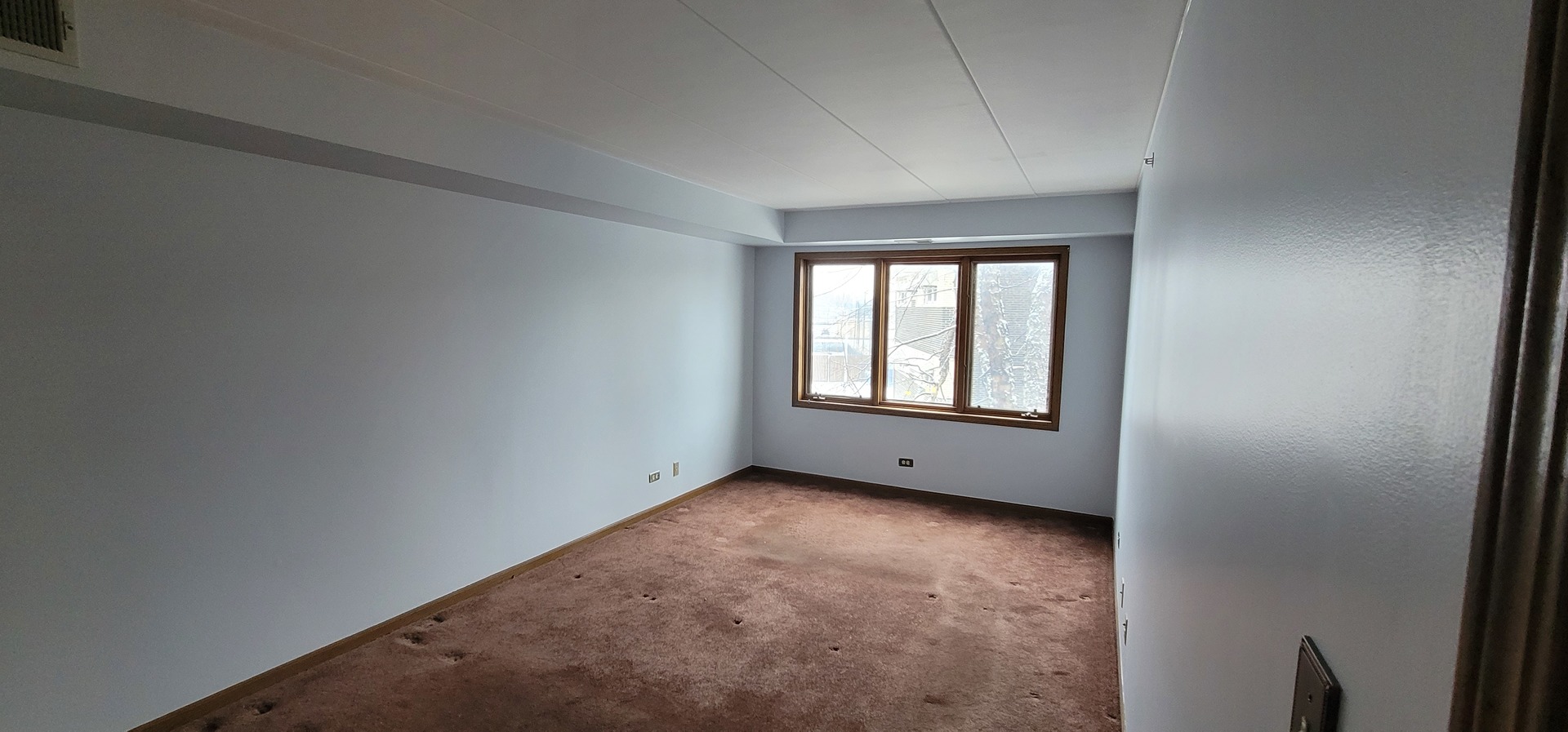 4530 West 93rd Street, Unit 2B Oak Lawn, IL 60453 - Photo 13 of 22 an empty room with a window