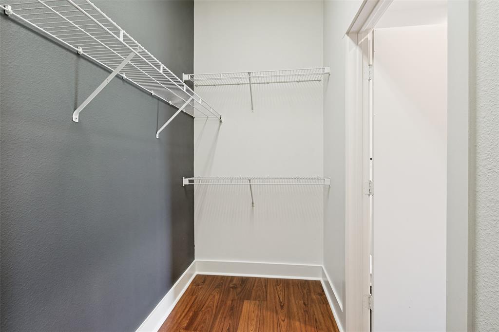 4414 Cedar Springs Road, Unit 320 Dallas, TX 75219 - Photo 16 of 17 a view of a room with racks on the wall