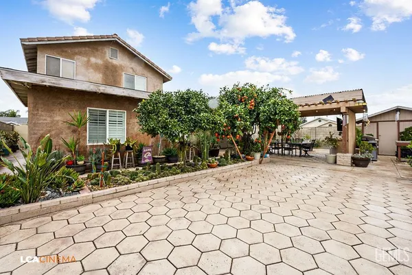 a view of a house with a backyard