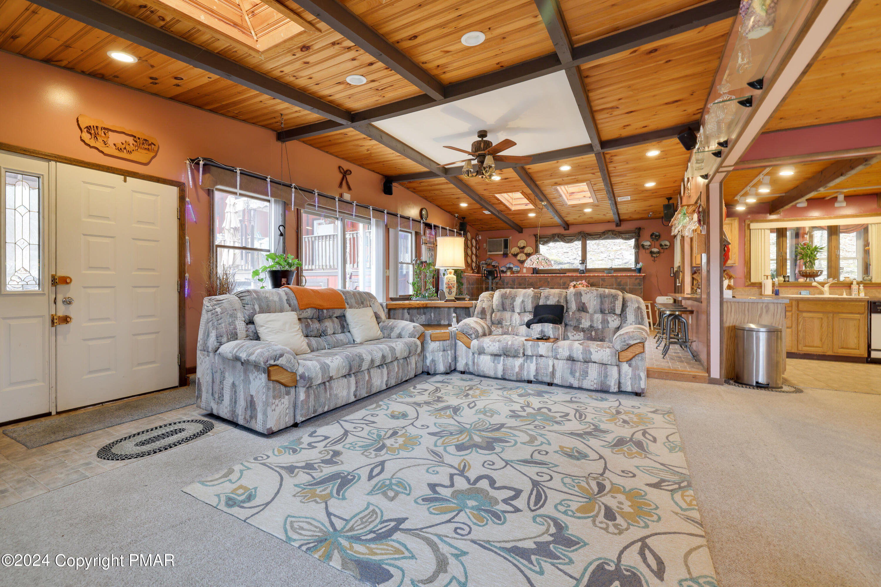 5817 Decker Road Bushkill, PA 18324 - Photo 6 of 62 a living room with furniture and a chandelier