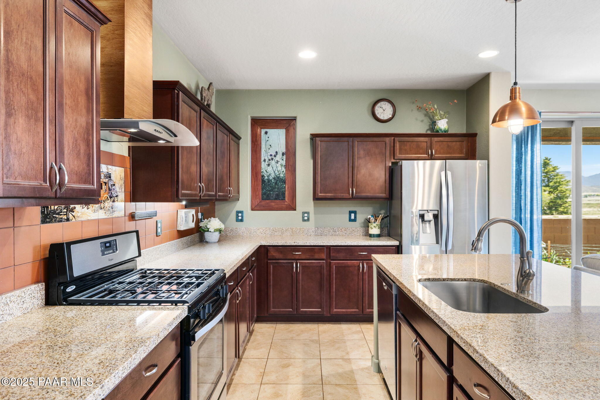 7794 Lavender Loop Prescott Valley, AZ 86315 - Photo 11 of 57 a kitchen with stainless steel appliances granite countertop a sink stove and refrigerator