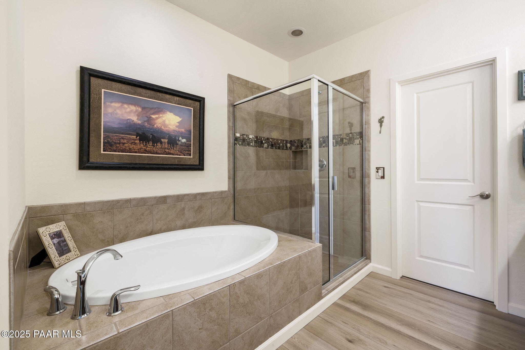 7794 Lavender Loop Prescott Valley, AZ 86315 - Photo 17 of 57 a bathroom with a tub and shower