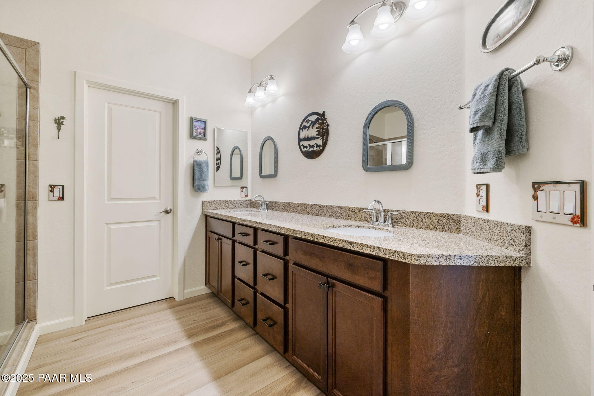 7794 Lavender Loop Prescott Valley, AZ 86315 - Photo 18 of 57 a bathroom with a granite countertop double vanity sink and a mirror