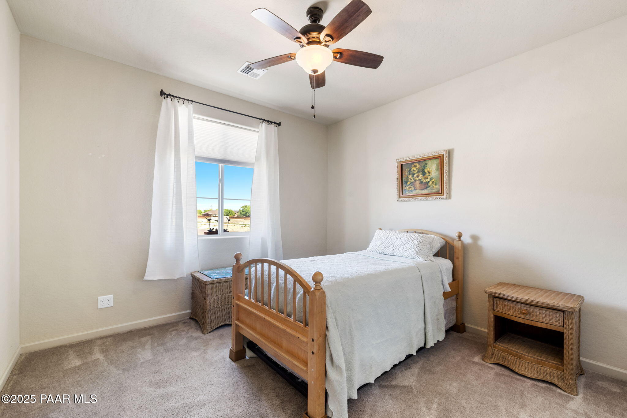 7794 Lavender Loop Prescott Valley, AZ 86315 - Photo 20 of 57 a bedroom with a bed and a chandelier