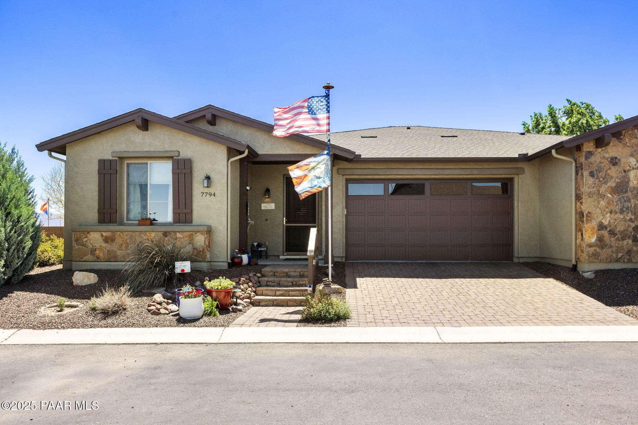 7794 Lavender Loop Prescott Valley, AZ 86315 - Photo 2 of 57 a front view of a house with garage
