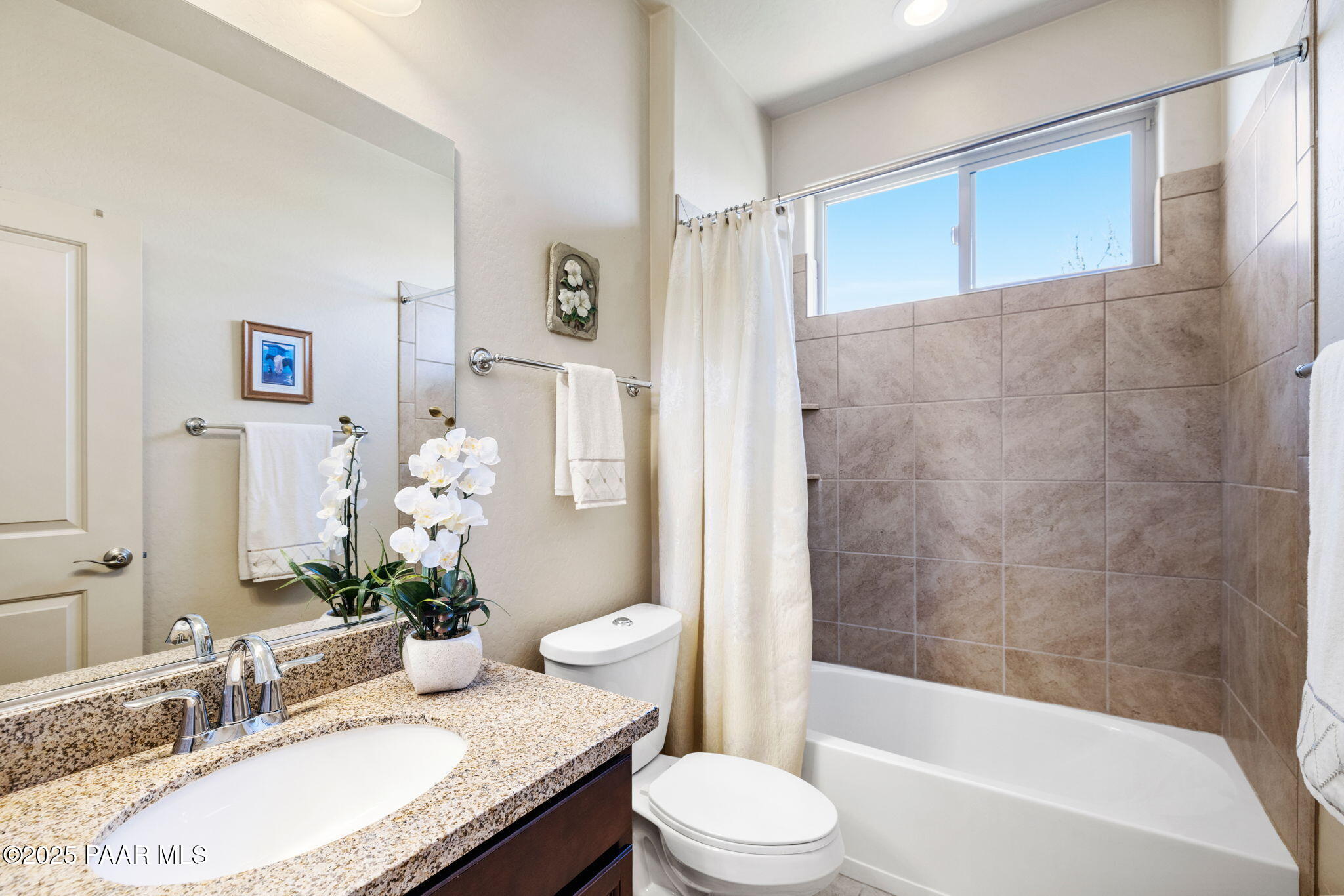 7794 Lavender Loop Prescott Valley, AZ 86315 - Photo 21 of 57 a bathroom with a granite countertop sink toilet and shower