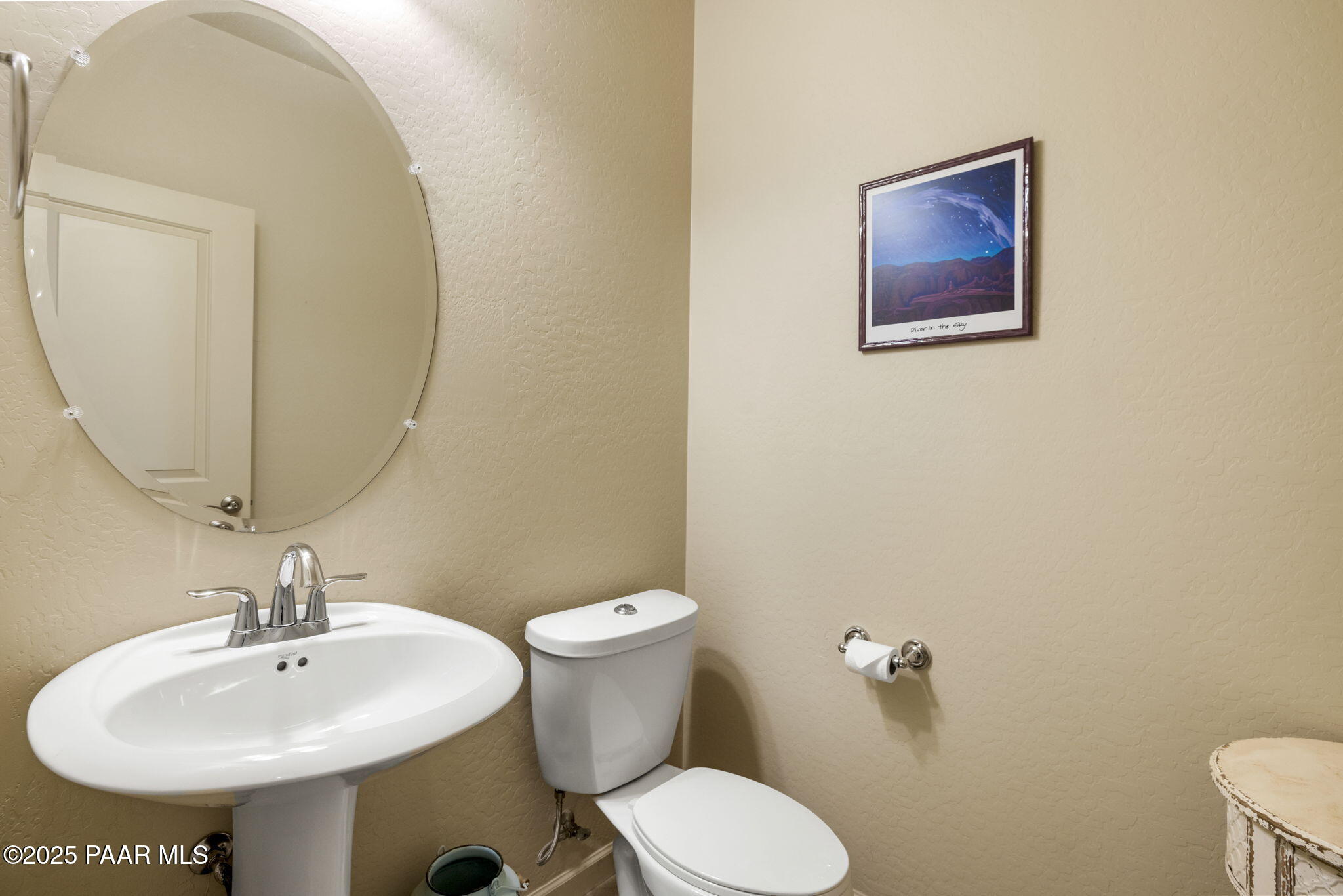 7794 Lavender Loop Prescott Valley, AZ 86315 - Photo 22 of 57 a bathroom with a toilet sink and mirror