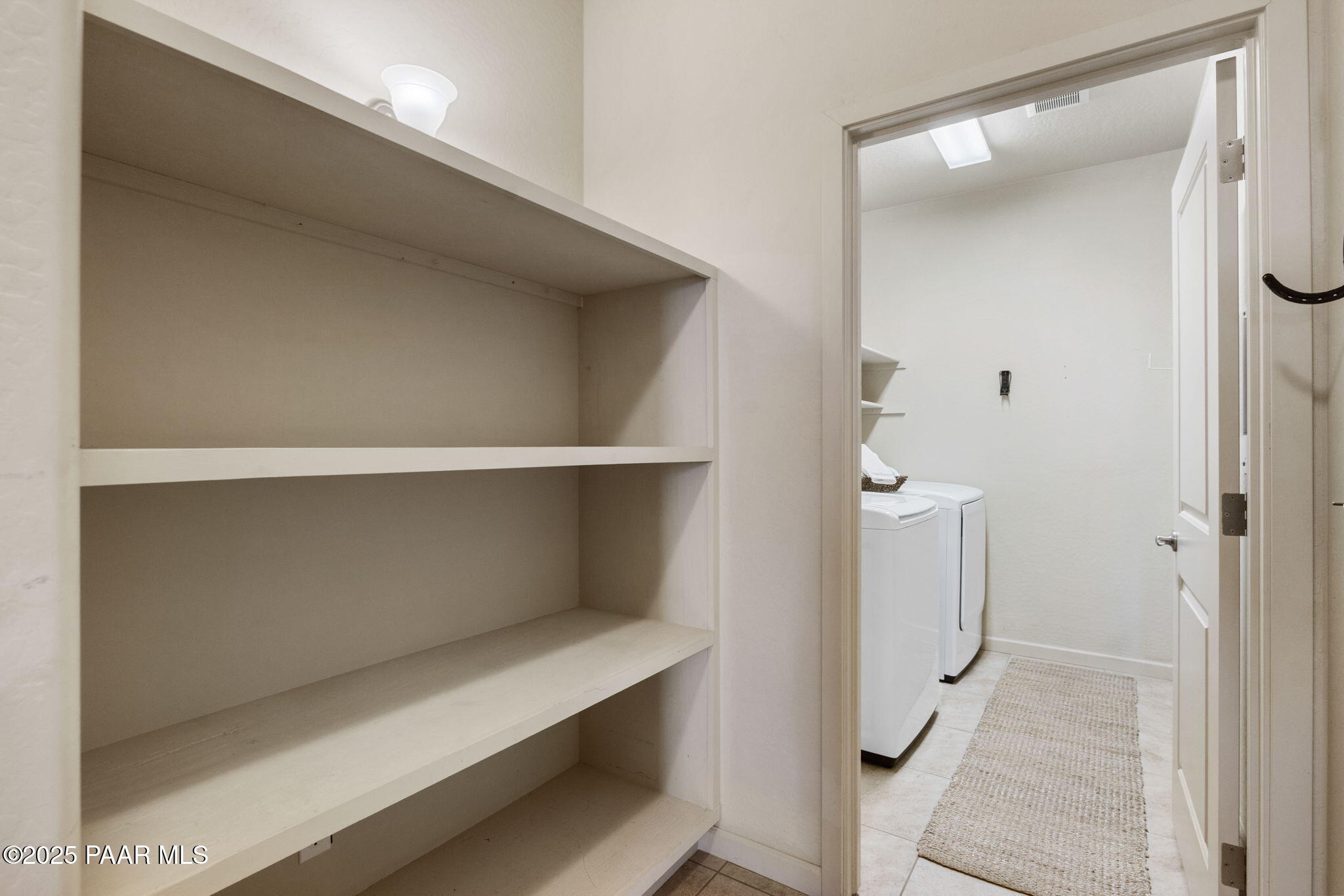 7794 Lavender Loop Prescott Valley, AZ 86315 - Photo 23 of 57 a hallway with washer and dryer