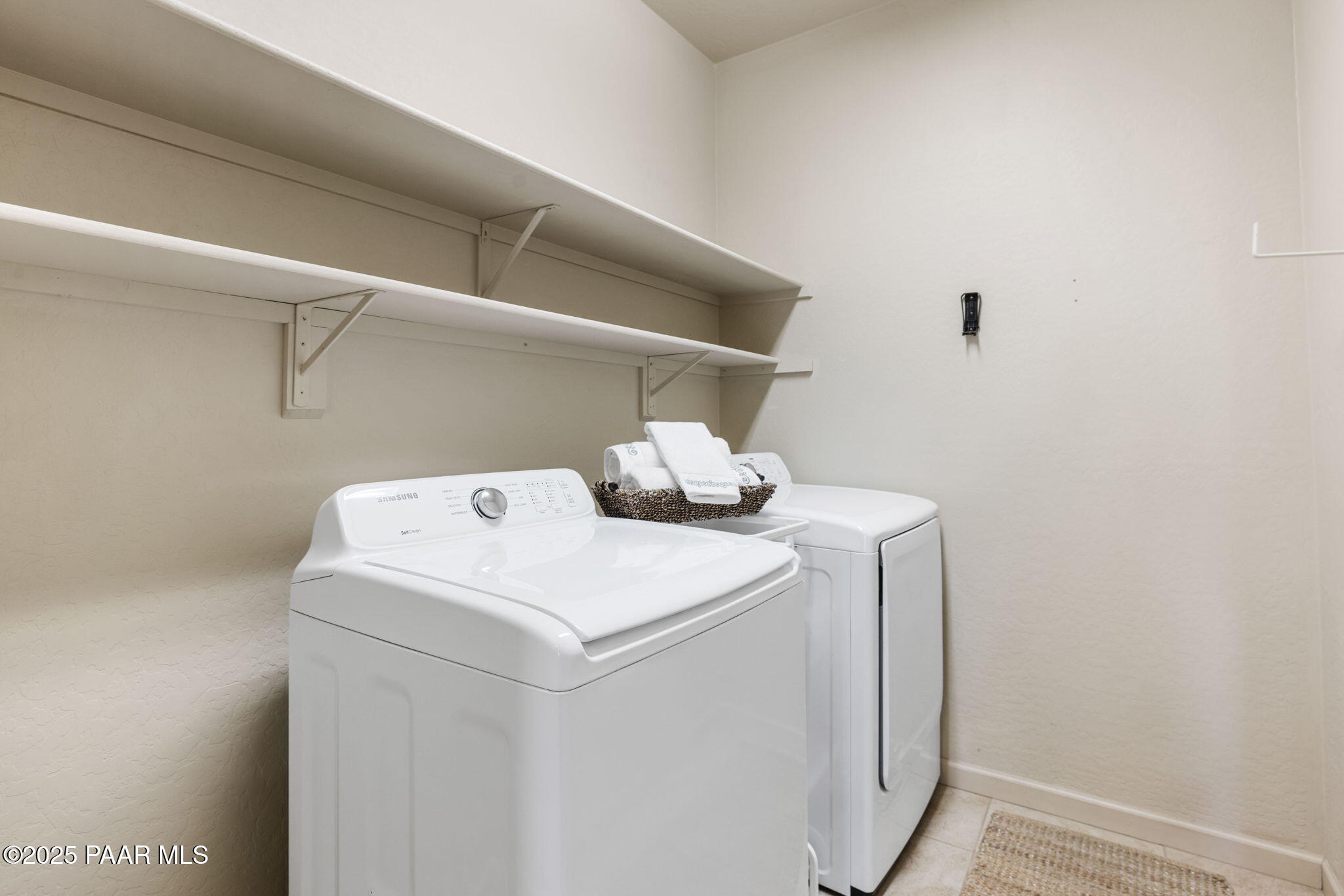 7794 Lavender Loop Prescott Valley, AZ 86315 - Photo 24 of 57 a utility room with dryer and washer