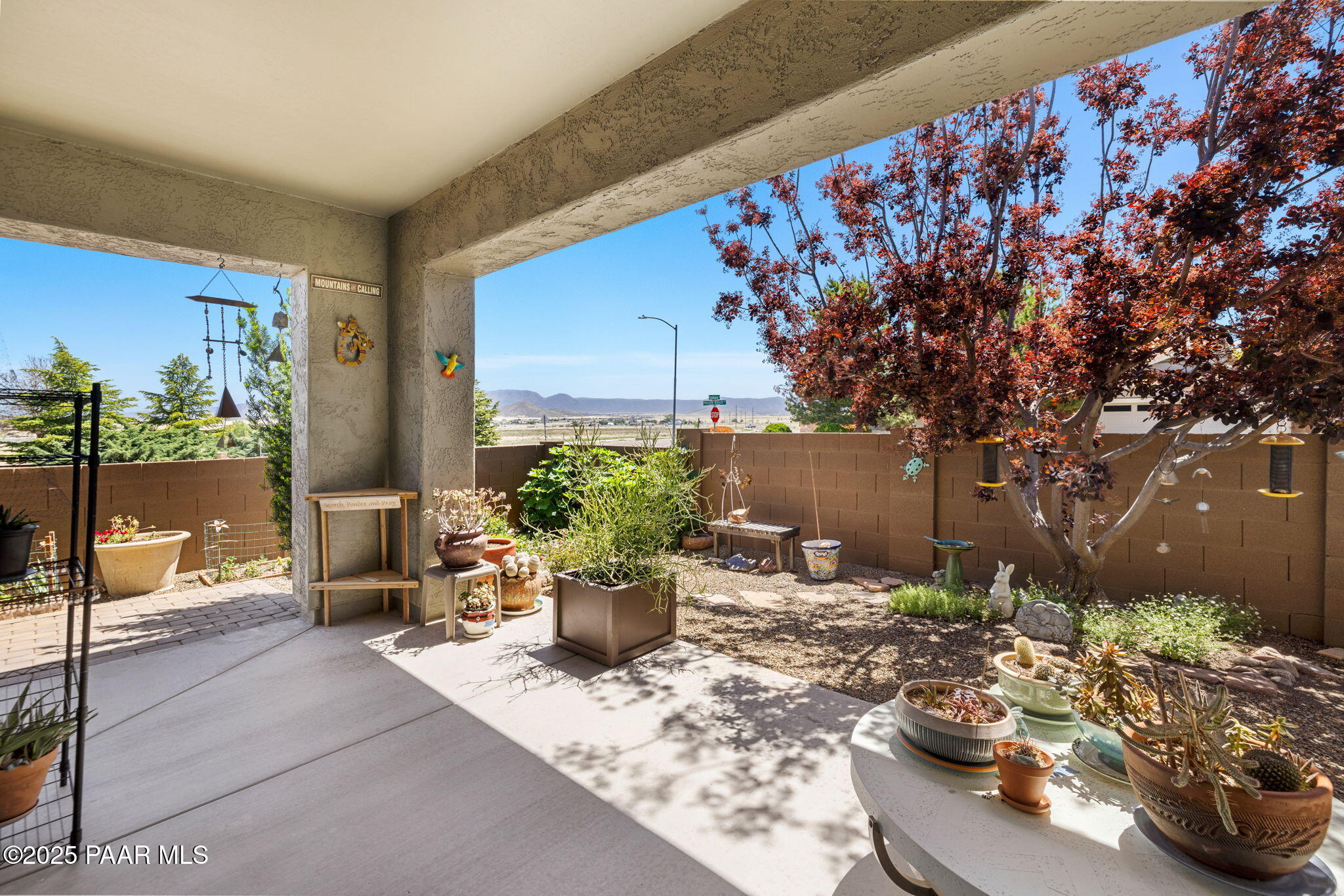 7794 Lavender Loop Prescott Valley, AZ 86315 - Photo 26 of 57 a view of a backyard with sitting area