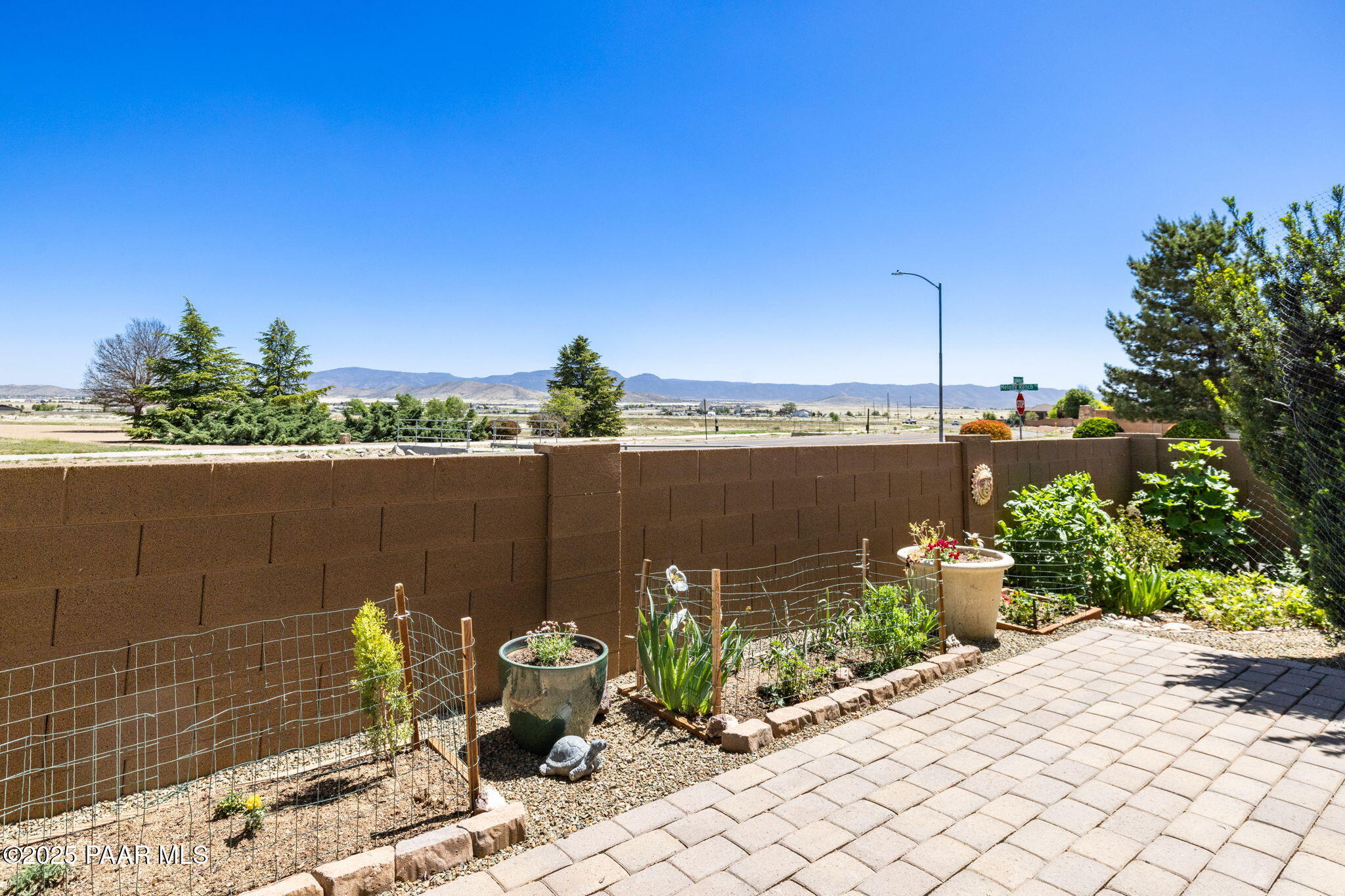7794 Lavender Loop Prescott Valley, AZ 86315 - Photo 30 of 57 a wooden bench sitting next to a lake