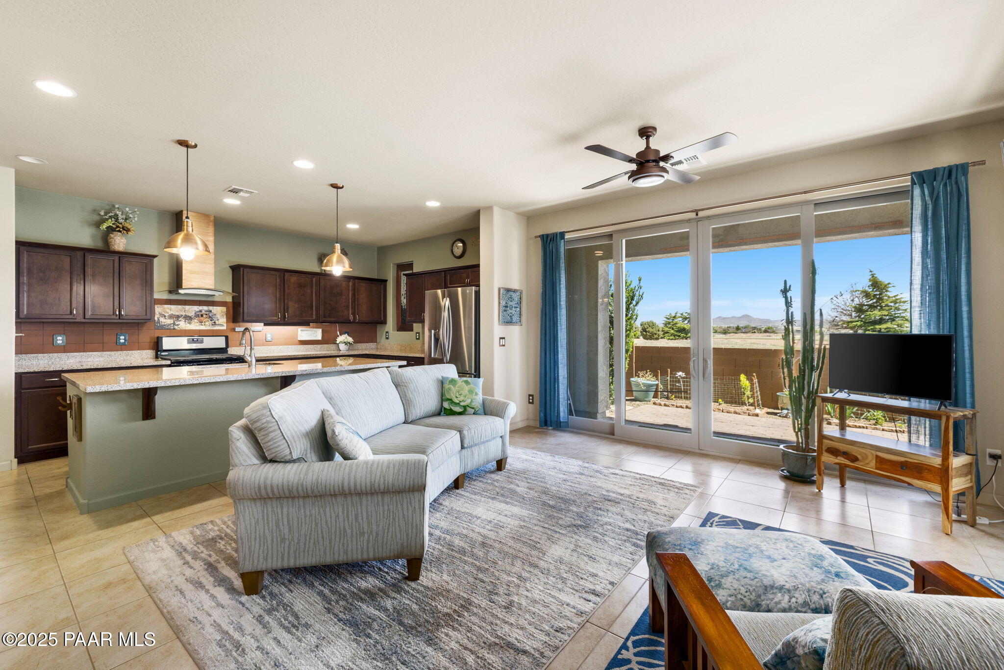 7794 Lavender Loop Prescott Valley, AZ 86315 - Photo 8 of 57 a living room with kitchen view and a kitchen view