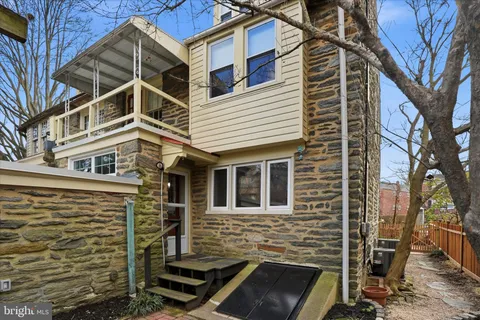a front view of a house with stairs