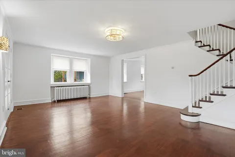 a view of an entryway with wooden floor