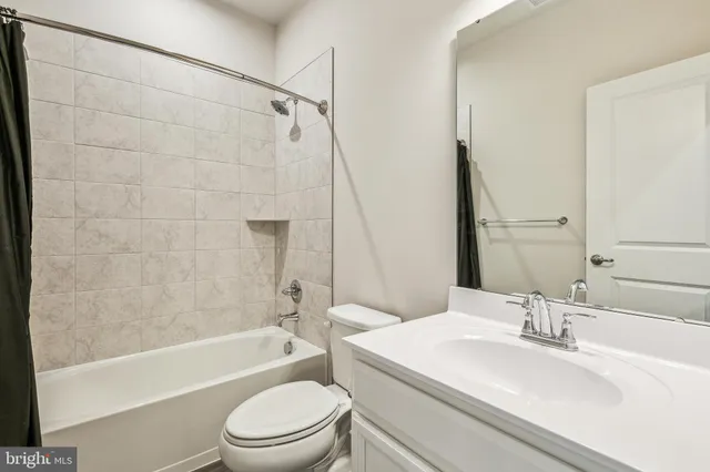 a bathroom with a sink a toilet and a bathtub