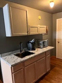 a kitchen with a sink and a refrigerator