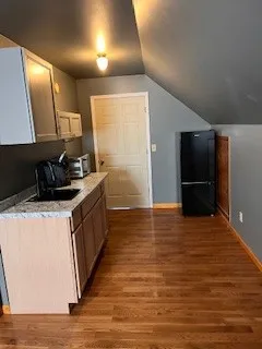 a kitchen with stainless steel appliances a refrigerator and a stove