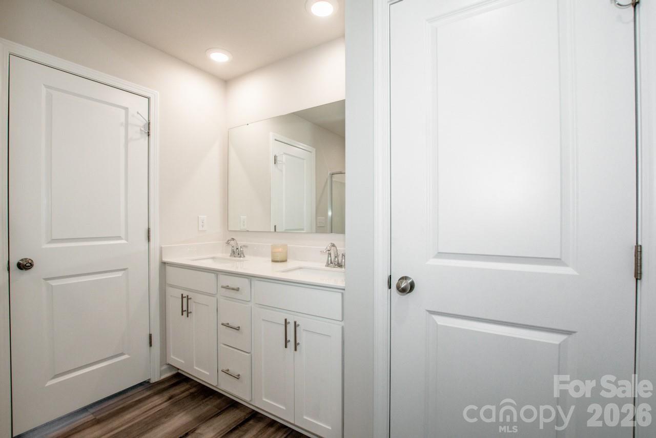 2742 Legacy Ridge Lane Catawba, NC 28609 - Photo 27 of 36 a bathroom with a double vanity sink and mirror