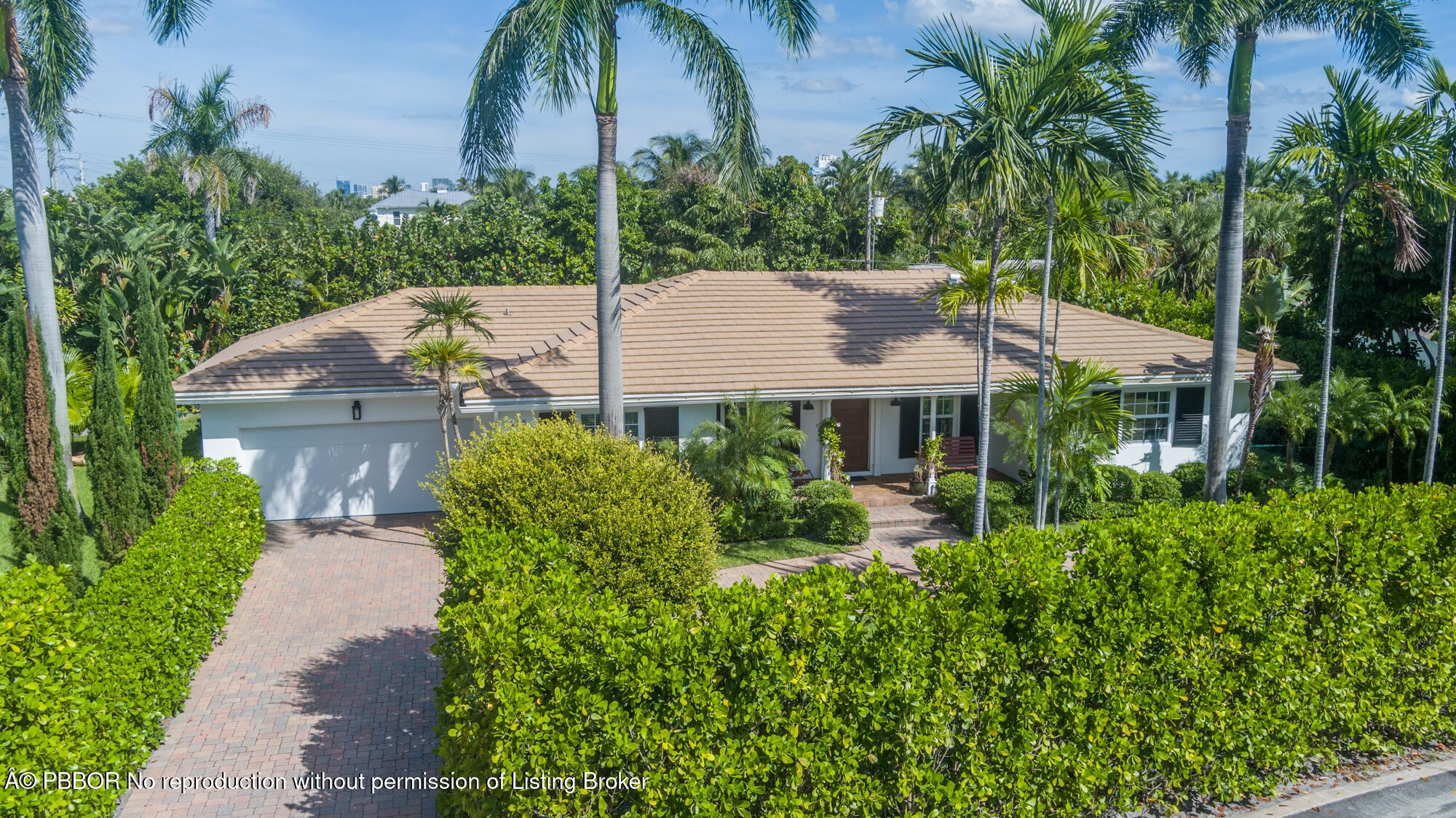 a house with lots of trees in the background