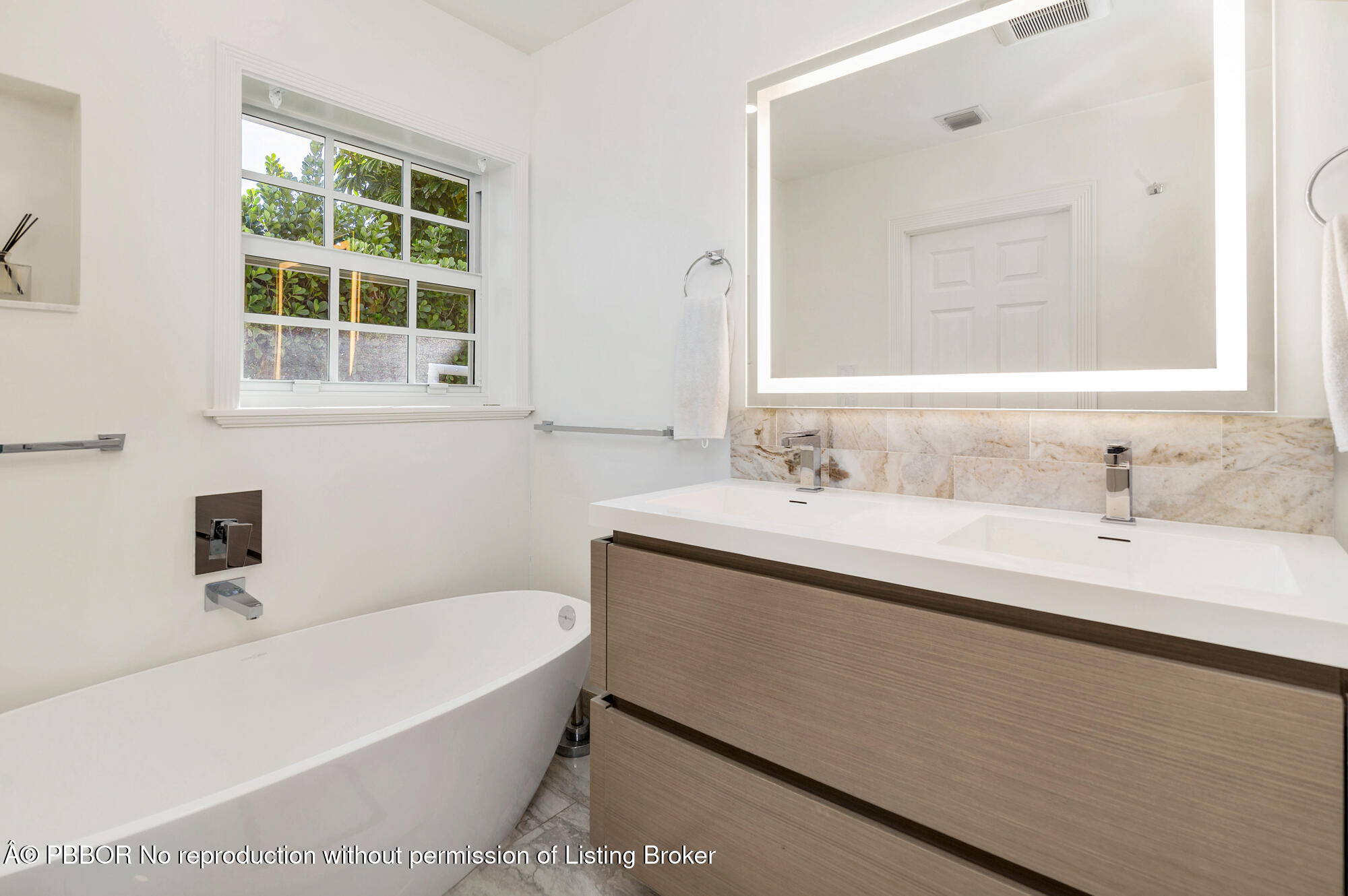 265 Rilyn Drive West Palm Beach, FL 33405 - Photo 12 of 23 a bathroom with a tub a sink and a window