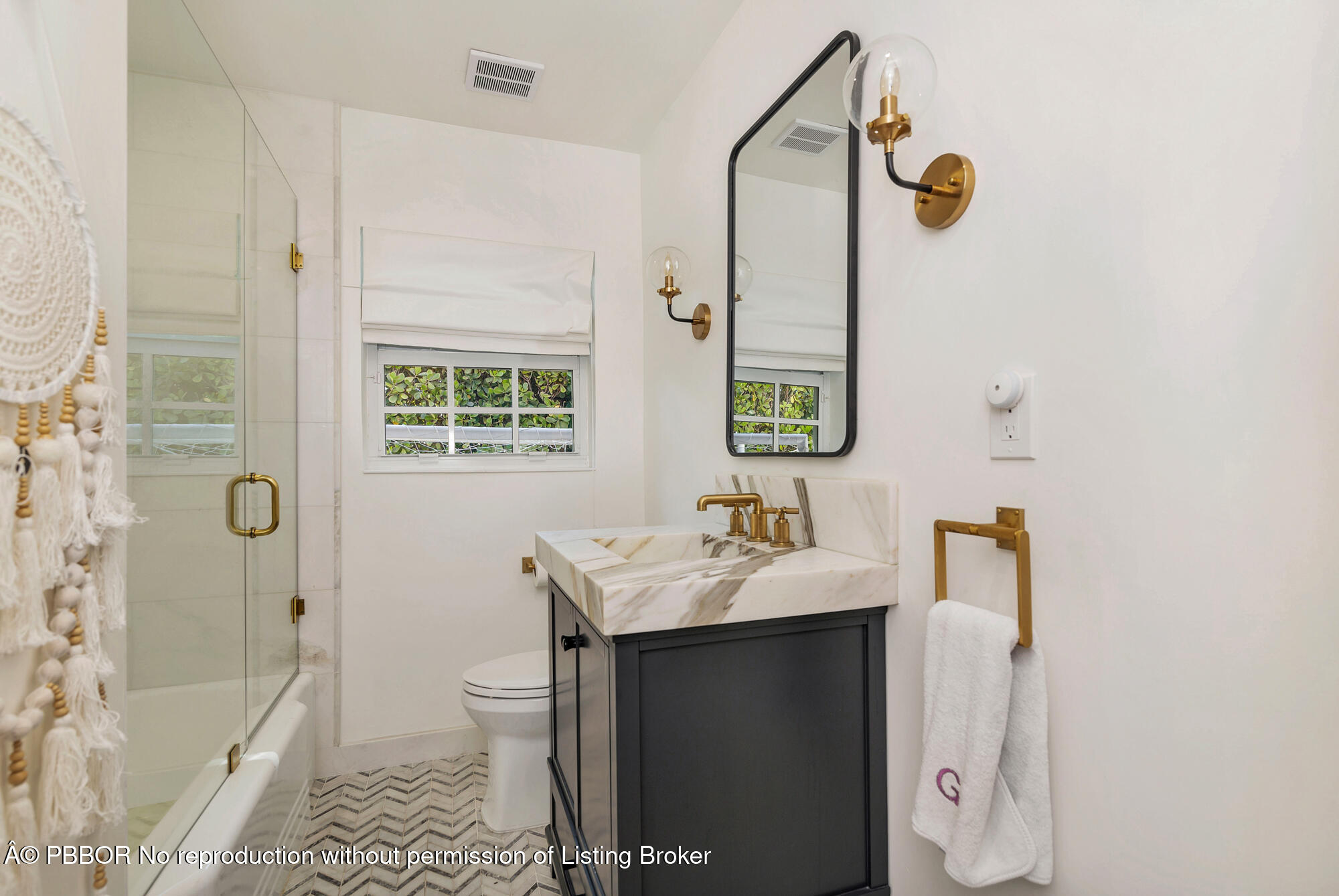 265 Rilyn Drive West Palm Beach, FL 33405 - Photo 17 of 23 a bathroom with a sink toilet and shower