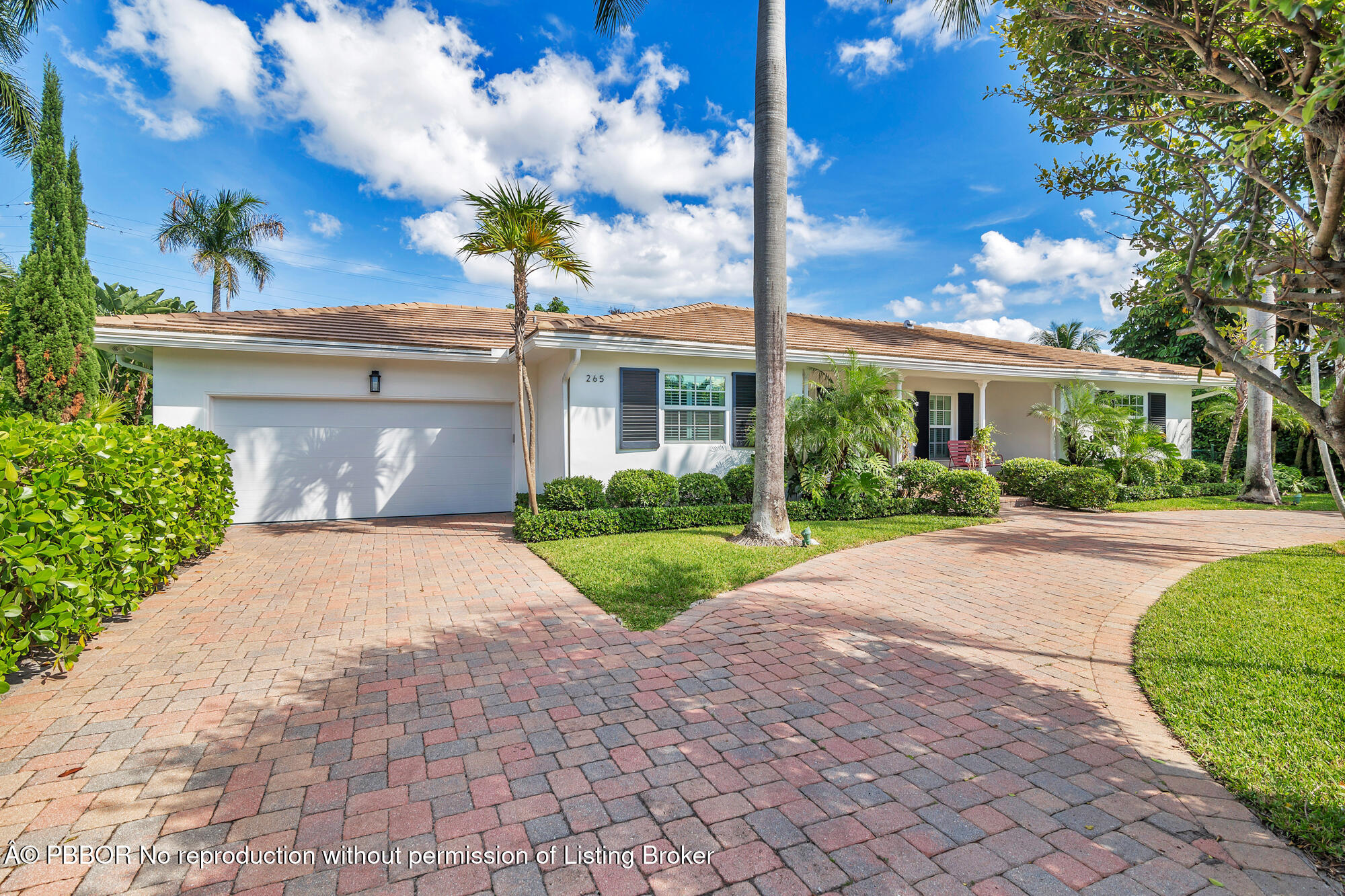 265 Rilyn Drive West Palm Beach, FL 33405 - Photo 2 of 23 a front view of a house with garden