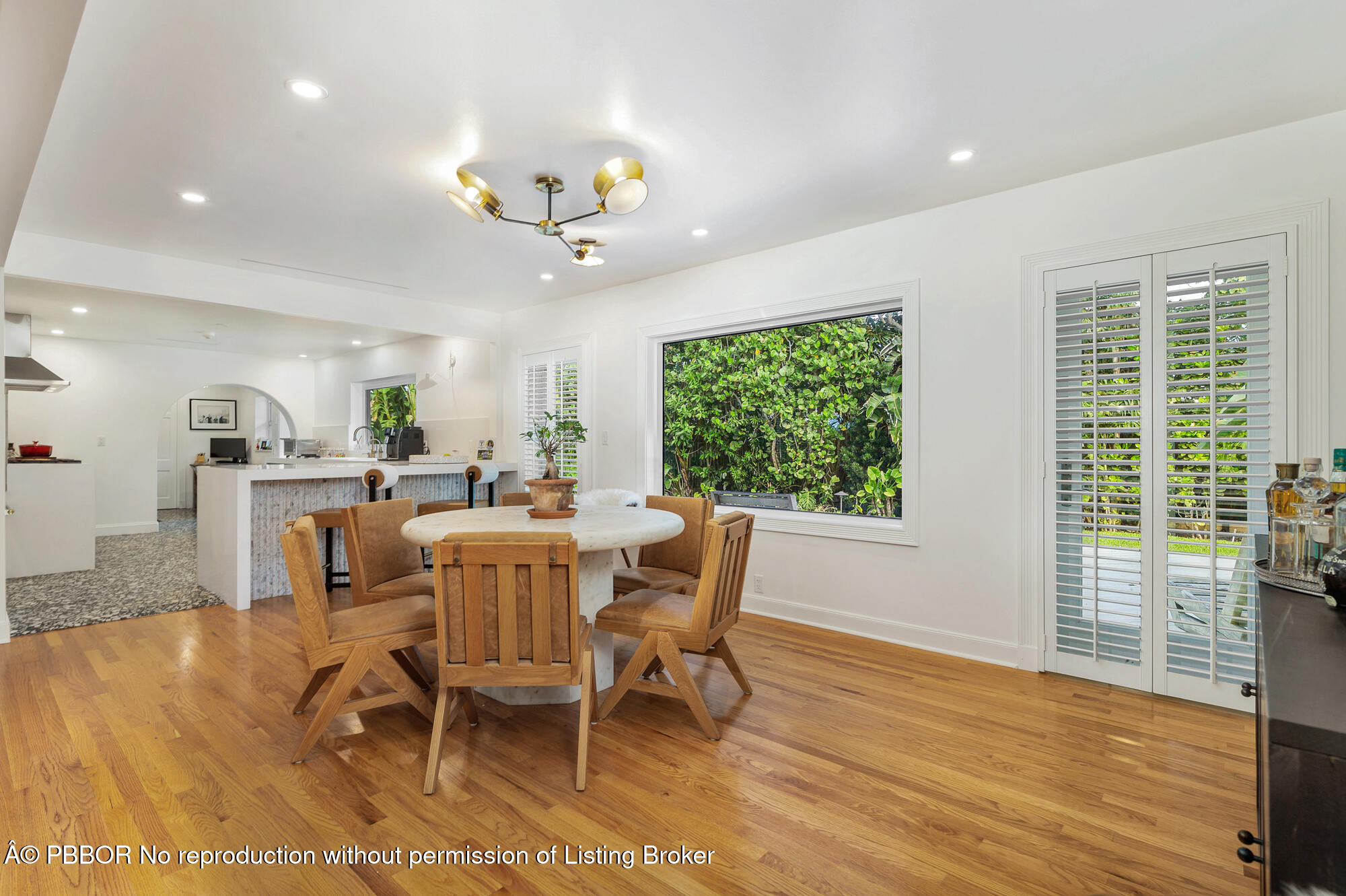 265 Rilyn Drive West Palm Beach, FL 33405 - Photo 5 of 23 a view of a dining room with furniture window and wooden floor