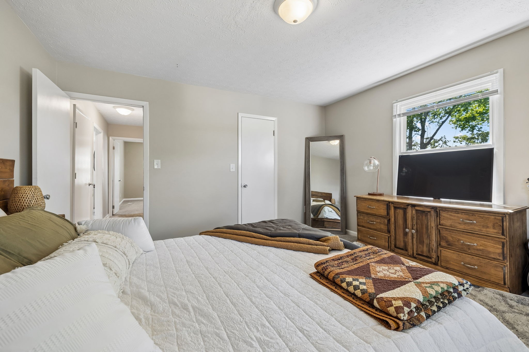 153 Old Lebanon Road Carthage, TN 37030 - Photo 17 of 29 a bedroom with a bed and a flat screen tv